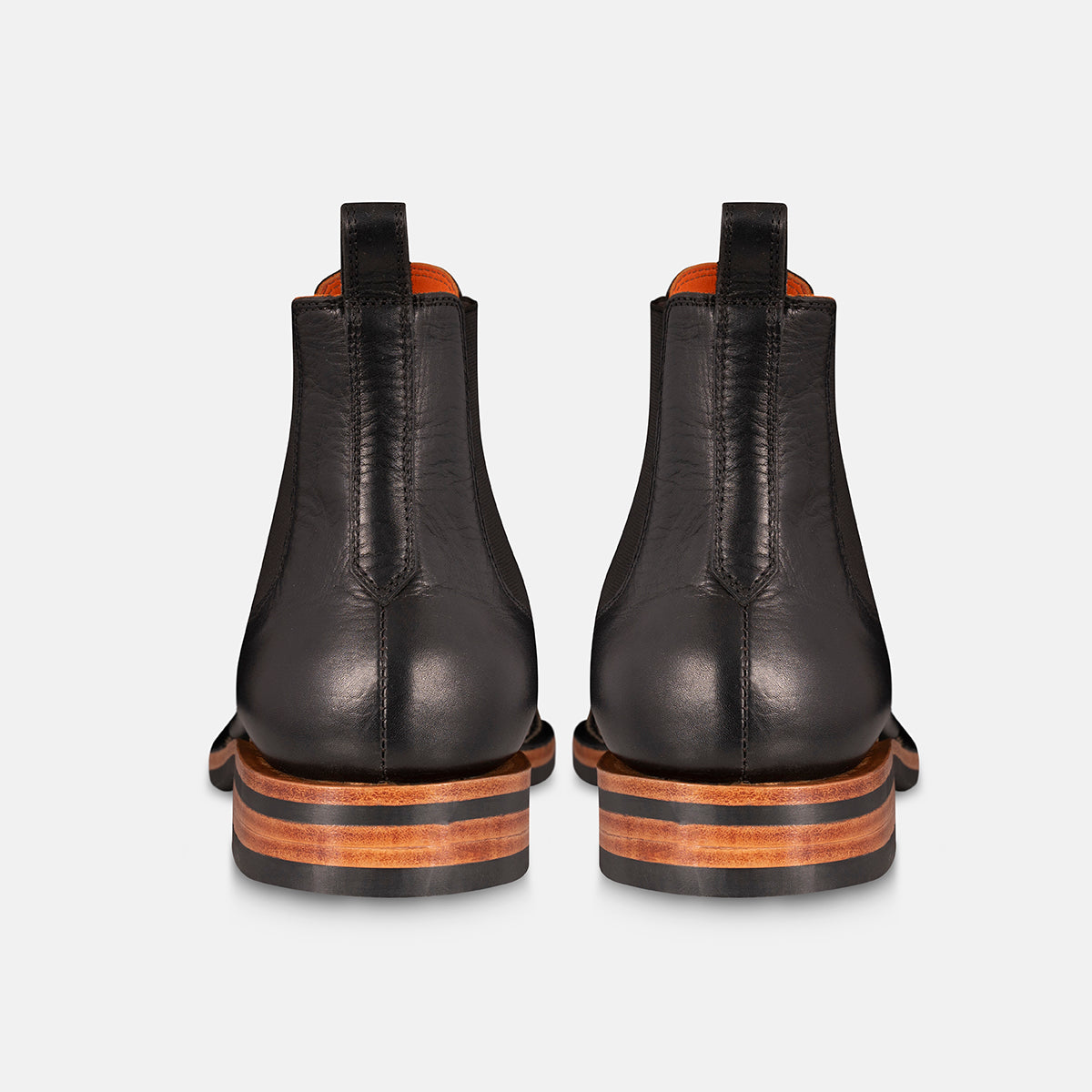 Chelsea boots in black back view