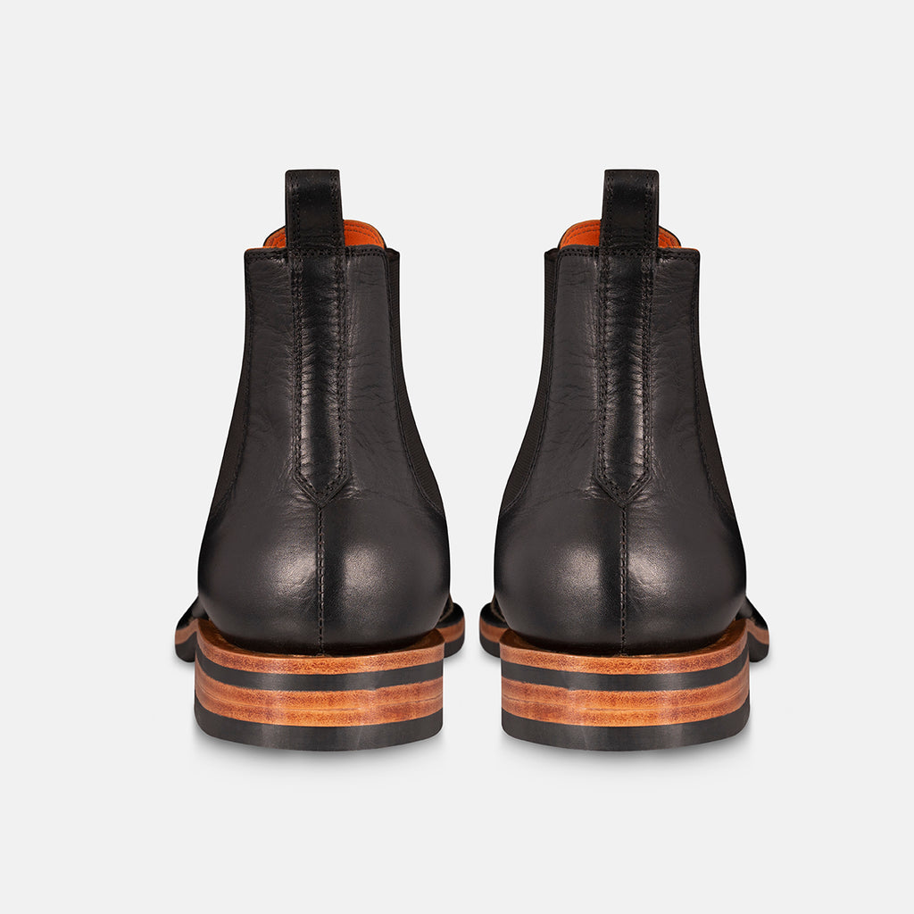 Chelsea boots in black back view